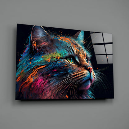 Colorful cat glass wall art mounted on gray wall, displaying vibrant blue, orange, and pink painted cat portrait with green eyes and black background.
