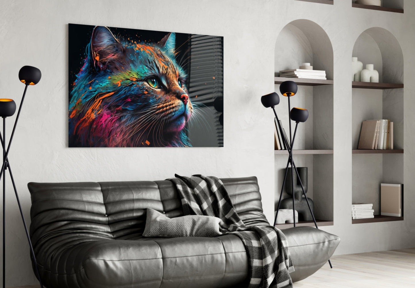 Colorful abstract cat portrait glass wall art hanging above gray leather sofa in modern living room with shelving.