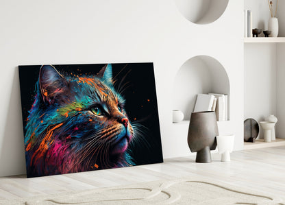 Colorful cat glass wall art leaning against white wall in minimalist interior with decorative objects and shelving.