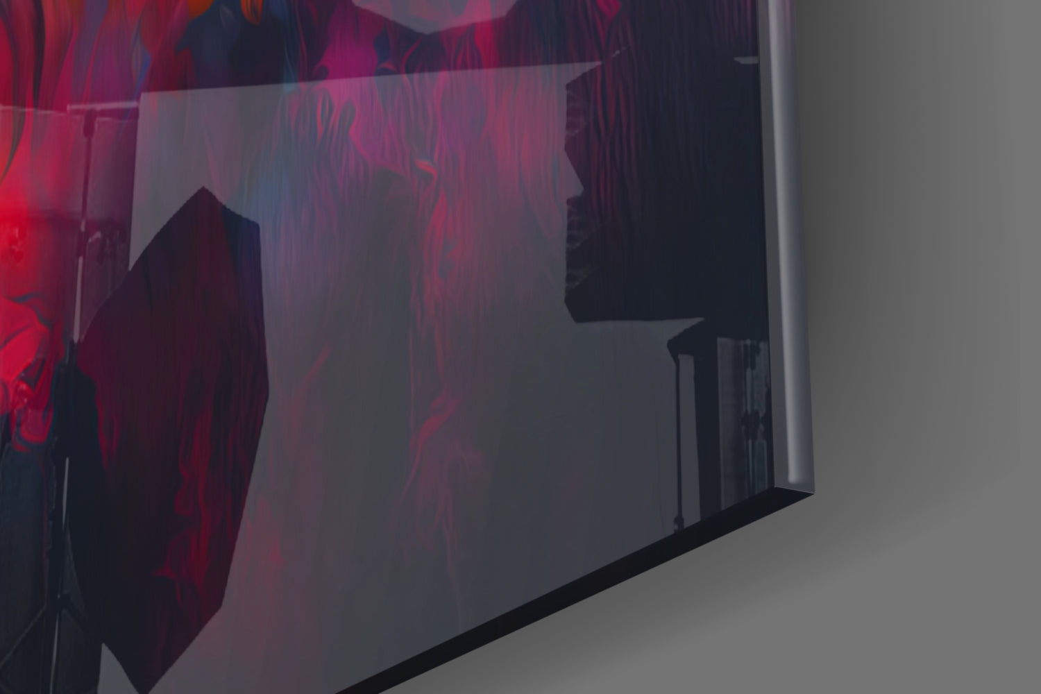 Angled view of glass wall art with red and dark silhouettes of wolves against translucent panel, mounted on white wall.