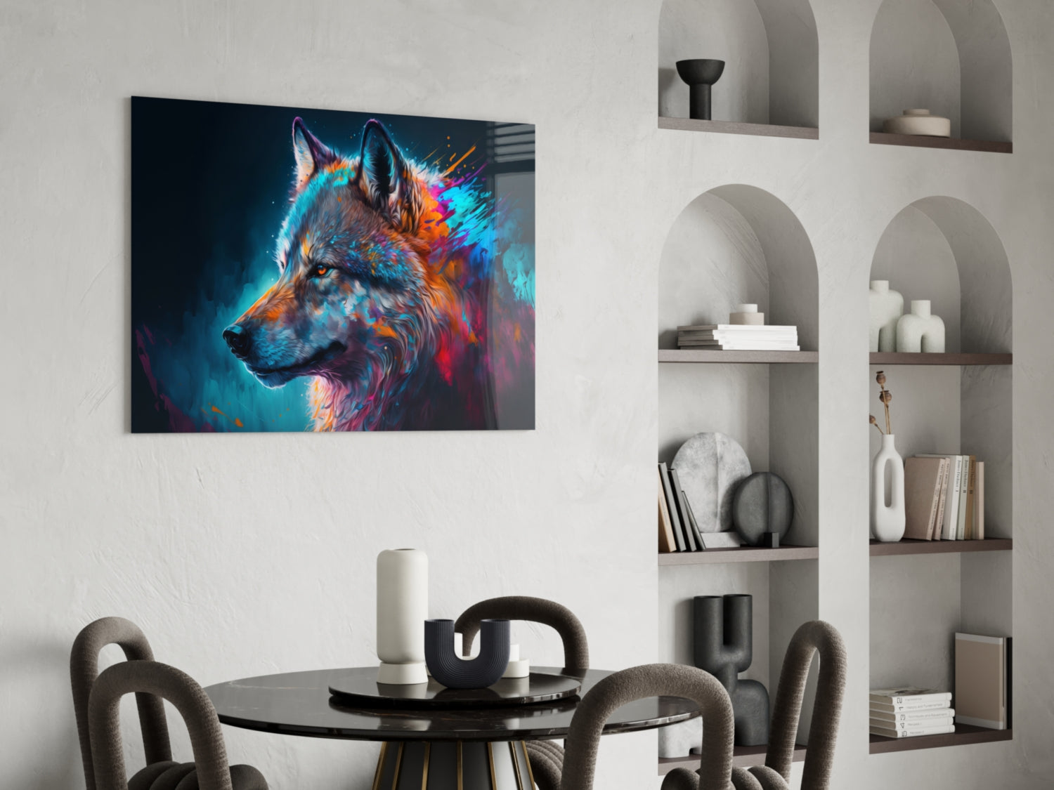 Colorful neon wolf portrait glass art displayed above black round dining table with grey chairs and white shelving unit.
