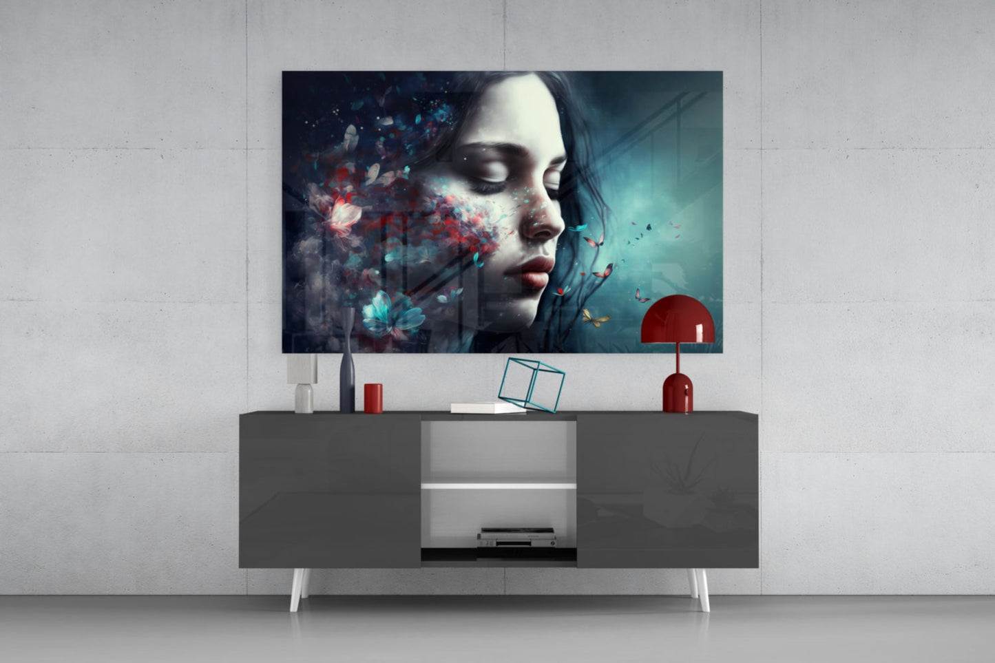 Butterfly Dreams glass wall art displayed above a modern gray media console, showing a woman's profile with colorful butterfly and particle effects against teal and red tones.