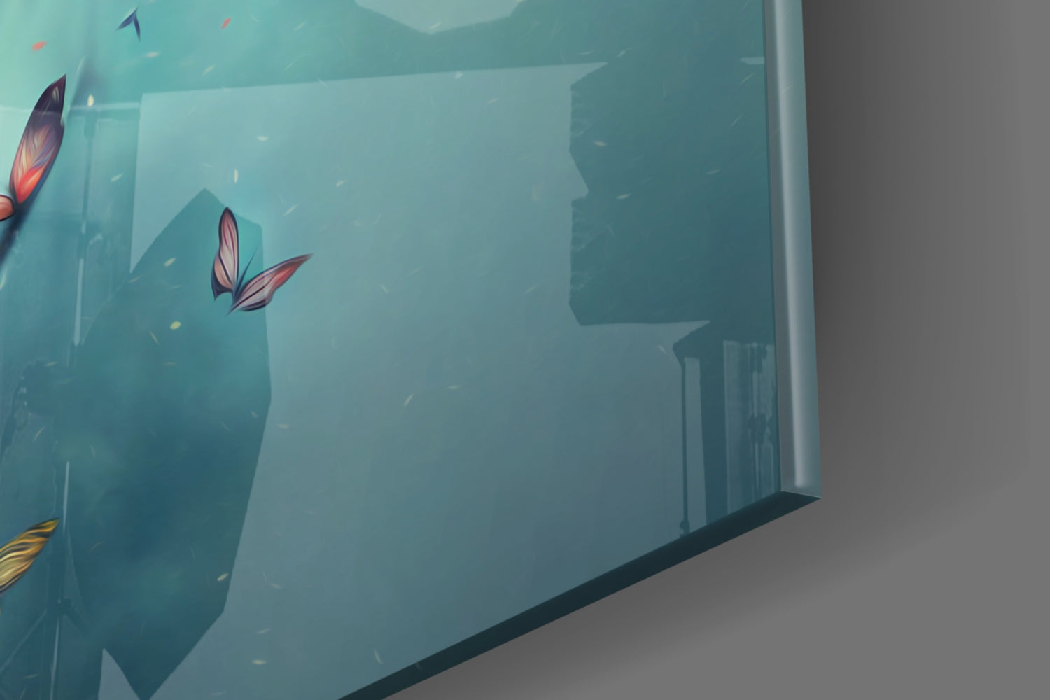 Glass wall art displayed at an angle showing turquoise underwater scene with red-winged butterflies and architectural silhouettes.