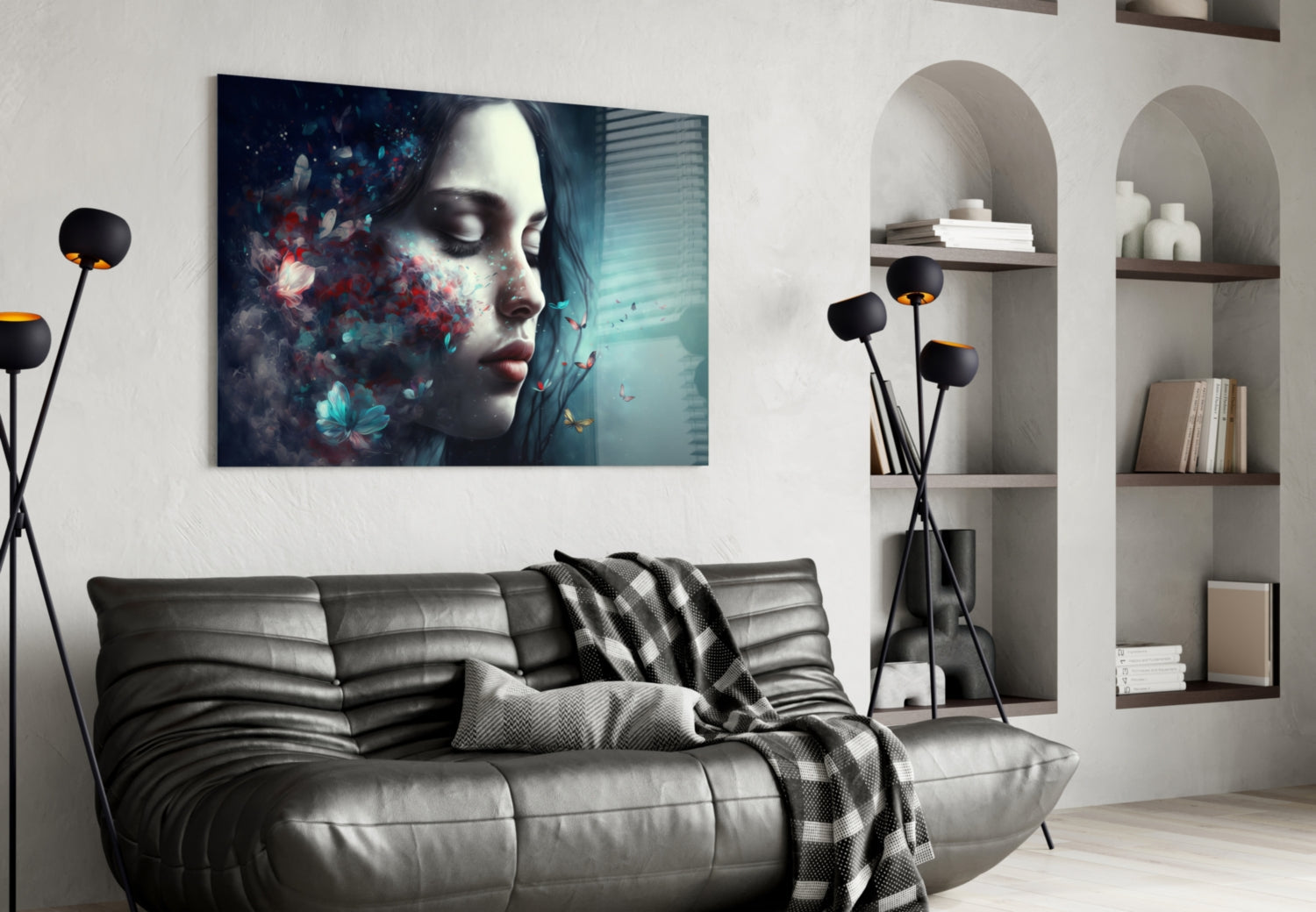 Glass wall art featuring a woman's profile with colorful flowers and particles in teal and red tones, displayed above a gray sofa.