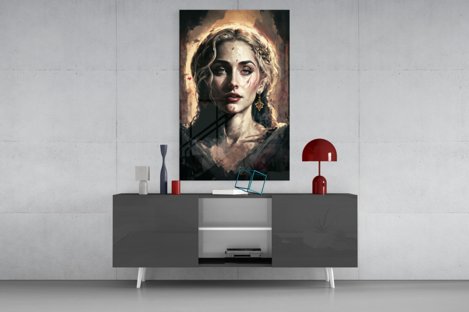 Portrait glass wall art of a woman with blonde braided hair and gold halo, displayed above modern gray sideboard with red lamp and accessories.