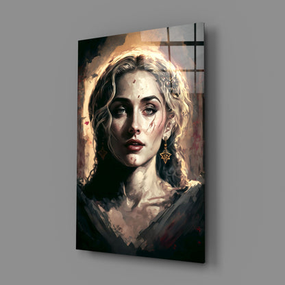 Glass wall art panel displaying a portrait of a woman with wavy blonde hair, gold star earring, and dramatic lighting against a dark background.