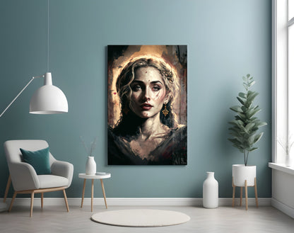 Portrait glass wall art depicting a woman with golden halo and earrings displayed in modern interior with turquoise walls.