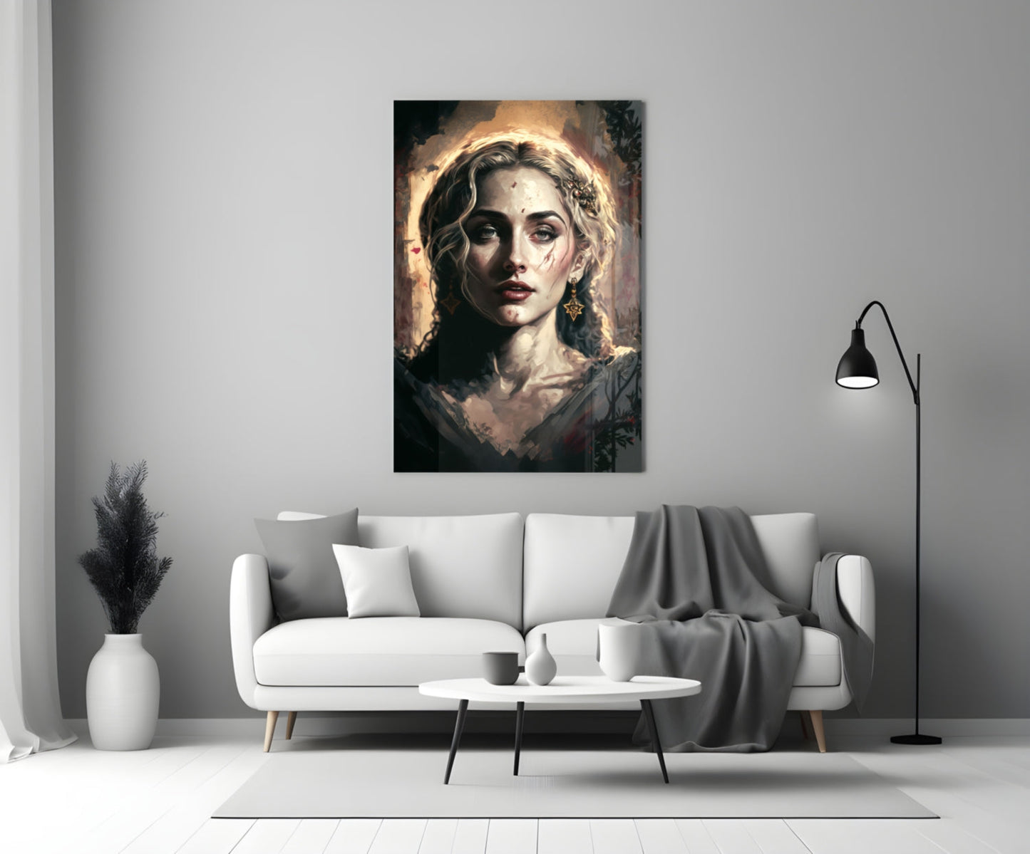 Madonna glass wall art depicting a woman with golden halo and dark wavy hair displayed above white sofa in modern living room.