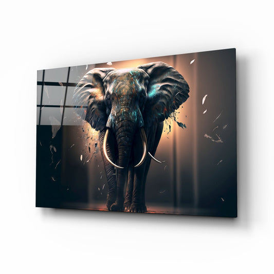 Glass wall art panel displaying a front-facing elephant with tusks, surrounded by warm golden and blue lighting effects against a dark background.