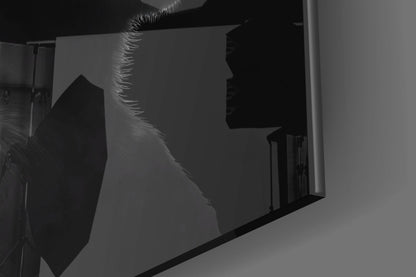 Silhouette view of chrome glass wall art featuring three monkeys in profile against backlit panel, showing reflective metallic surface detail.