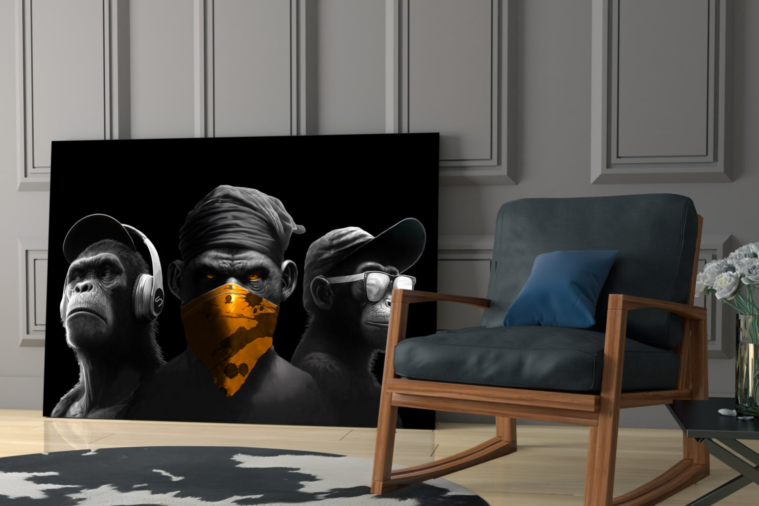 Three stylized black and white chimpanzees with gold accents displayed as glass wall art in a modern living room setting with wooden chair and paneled walls.