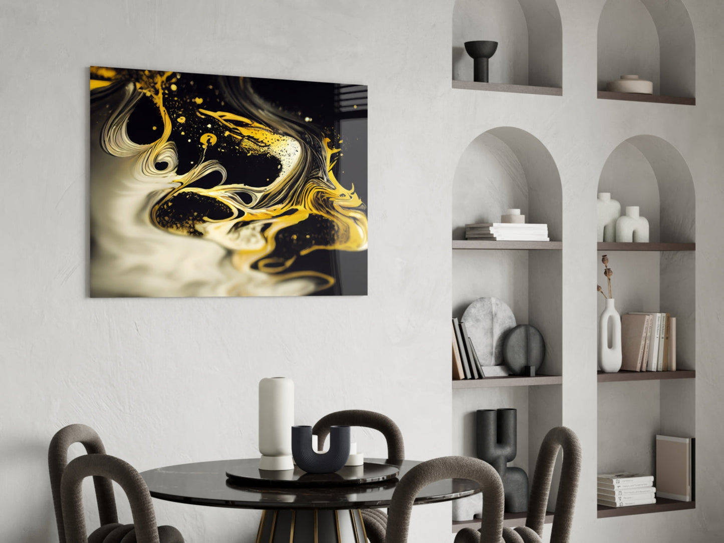 Black and gold swirled abstract glass art hanging above a round dining table with curved chairs and white shelving unit.