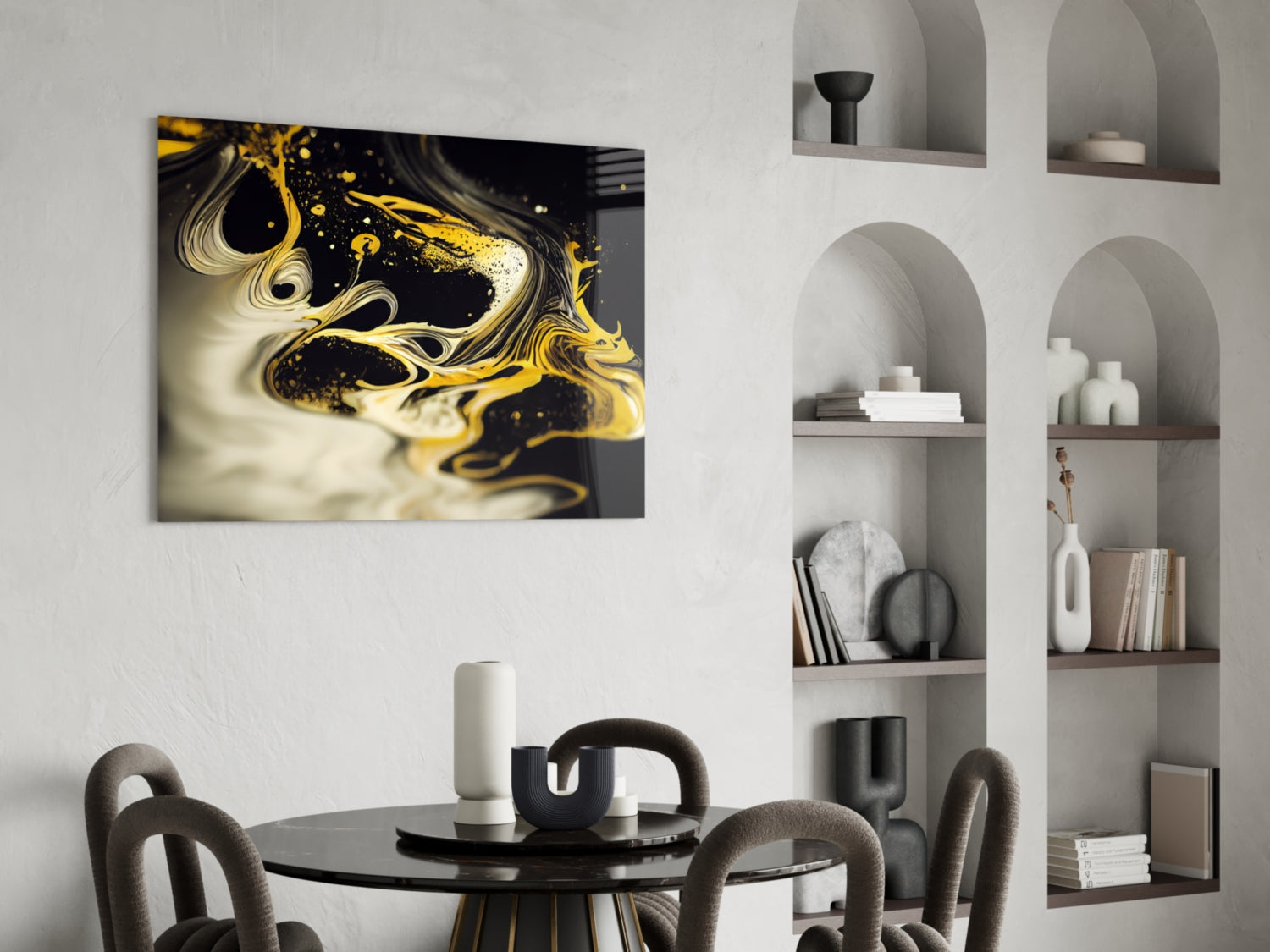 Black and gold swirled abstract glass art hanging above a round dining table with curved chairs and white shelving unit.