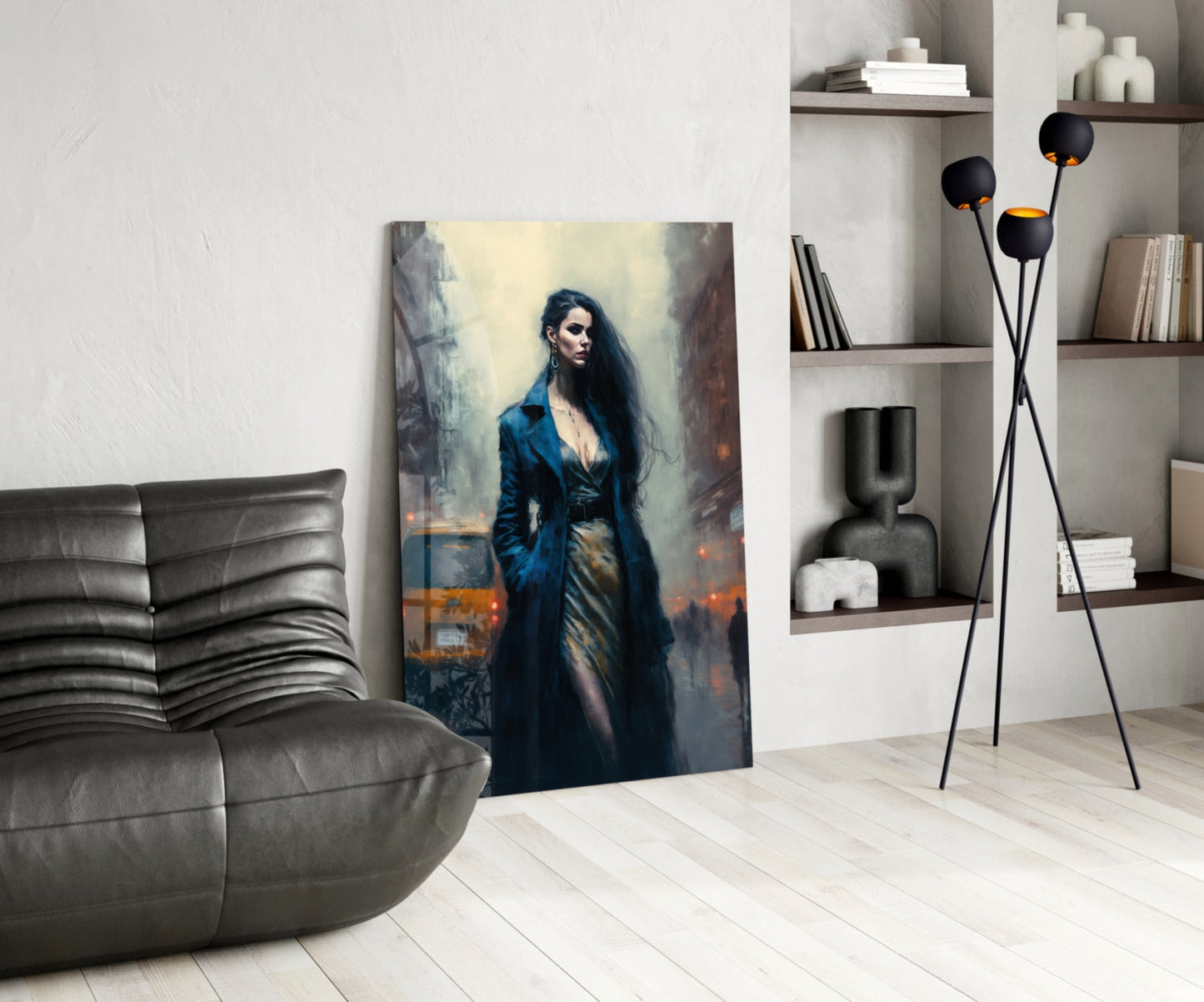 Modern living room interior featuring a vertical glass wall art panel depicting a woman in a blue coat against an urban backdrop.