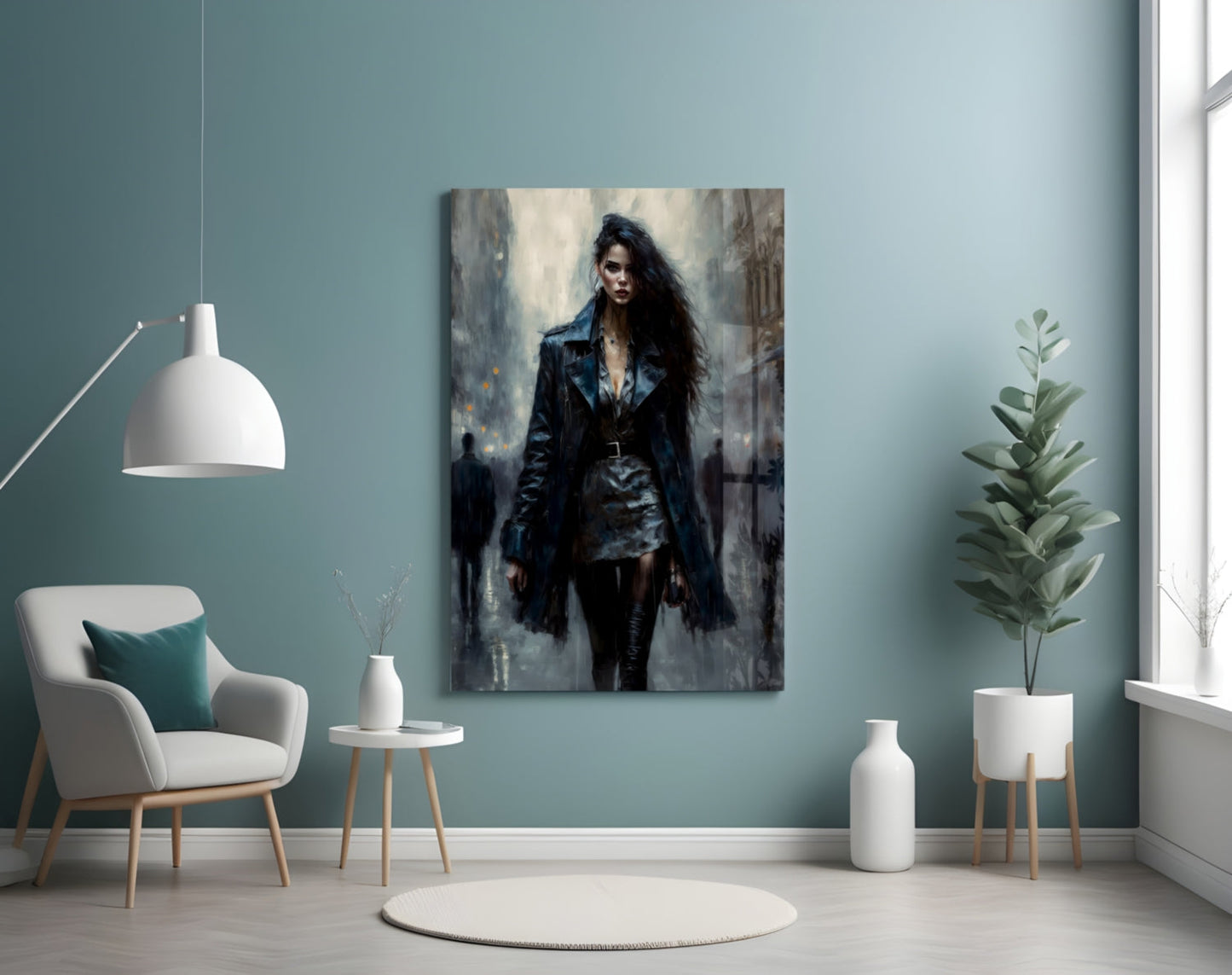 Glass wall art depicting a woman in black leather jacket and skirt standing in an urban setting, displayed above a white chair in a teal room.