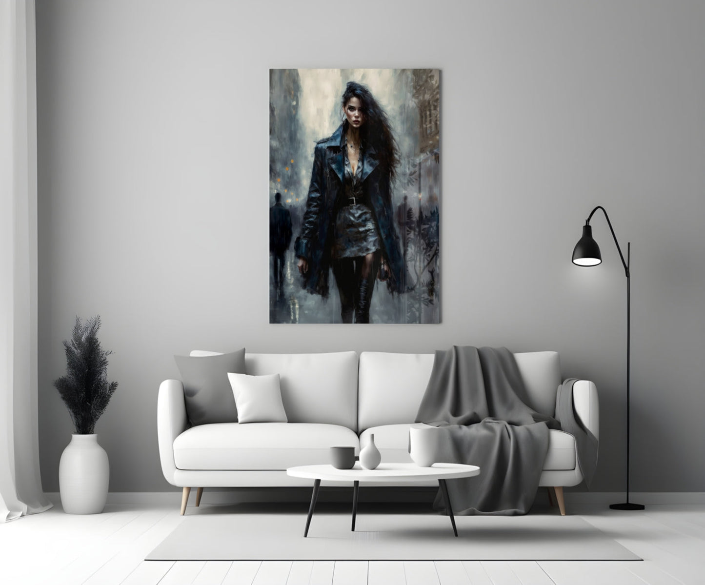 Glass wall art depicting a woman in dark leather jacket and long black hair standing in an urban setting, displayed above a white sofa in a modern living room.