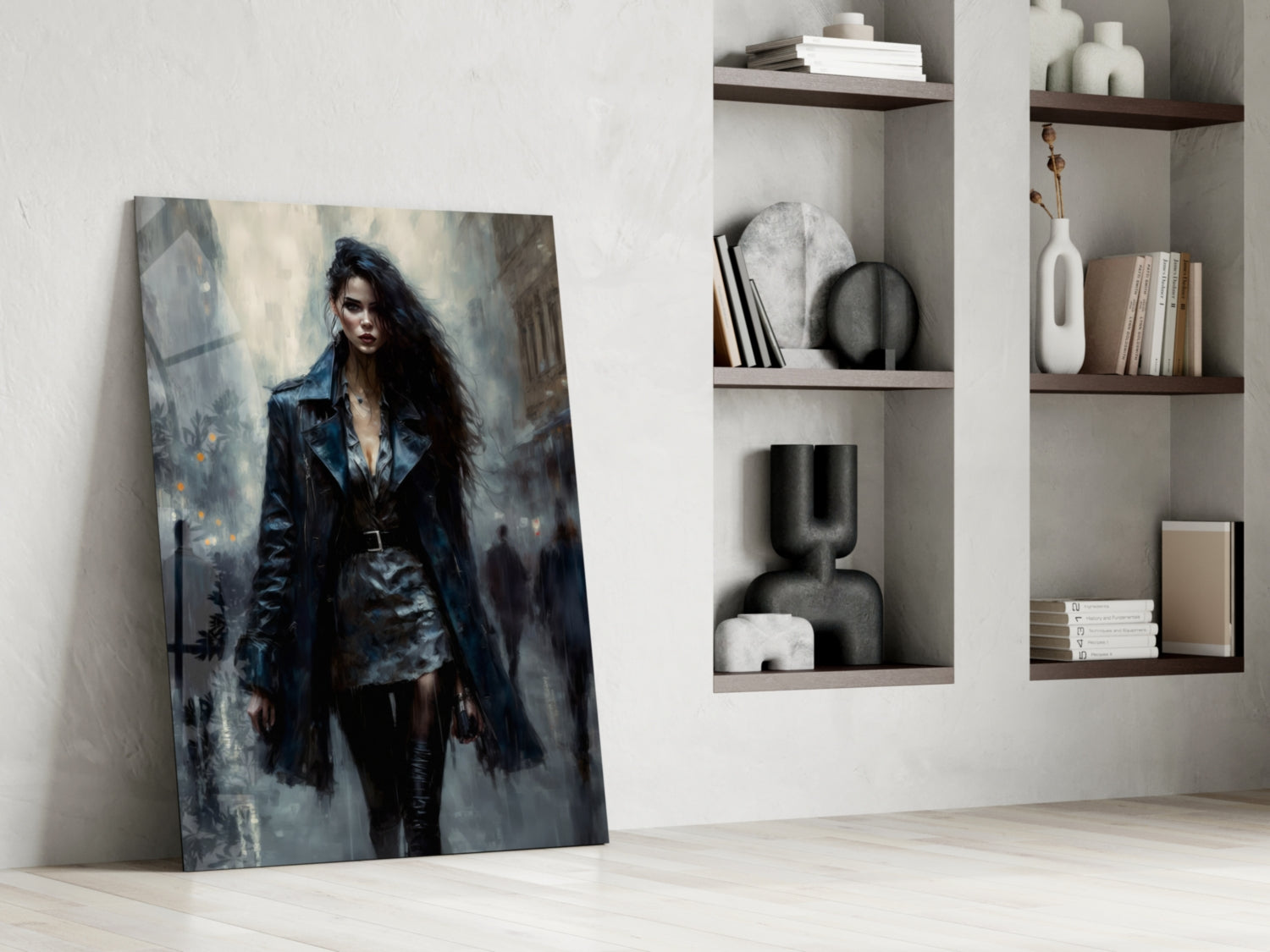 Glass wall art depicting a woman in dark leather jacket and black clothing against moody grey urban background, leaning against white wall beside wooden shelves.