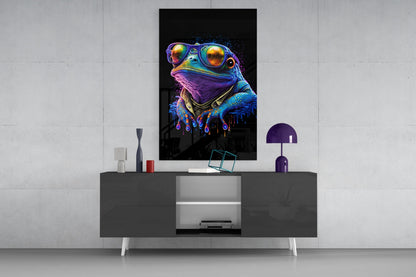 Neon-colored frog wearing sunglasses and bandana displayed on wall above modern gray media console with purple lamp.