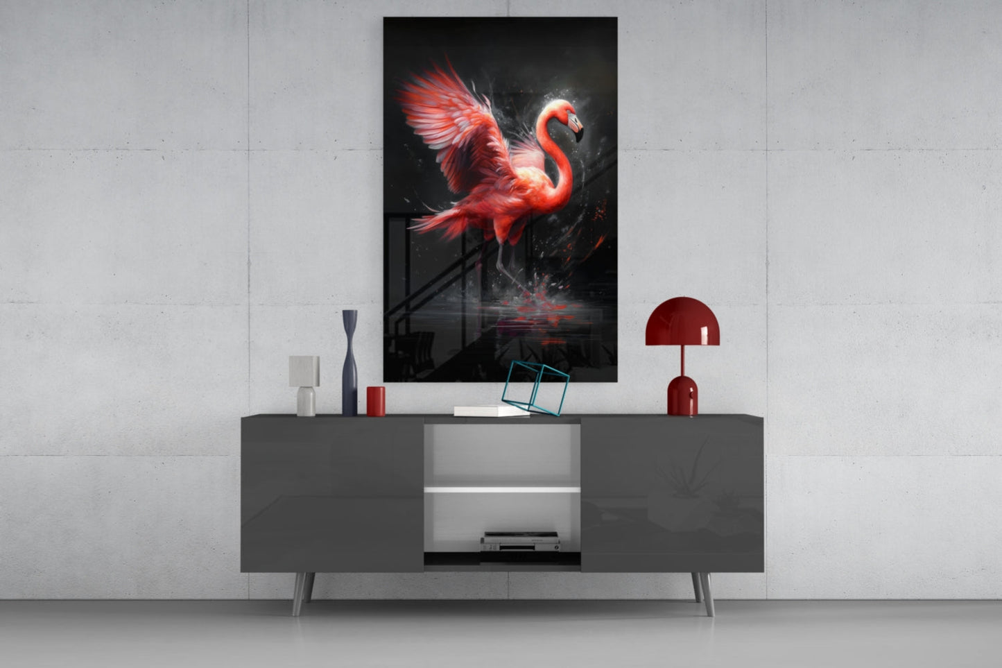 Red glowing flamingo glass wall art displayed above gray media console with red lamp and decorative accessories.
