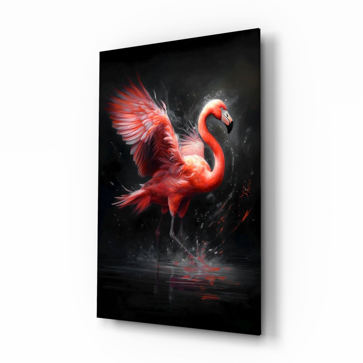 Red flamingo glass wall art displayed at an angle against white background, showing vibrant bird with splashing water effect on black glass.