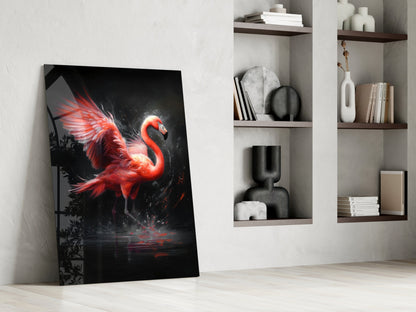 Red and black flamingo glass wall art leaning against white wall beside built-in shelving with books and decor.