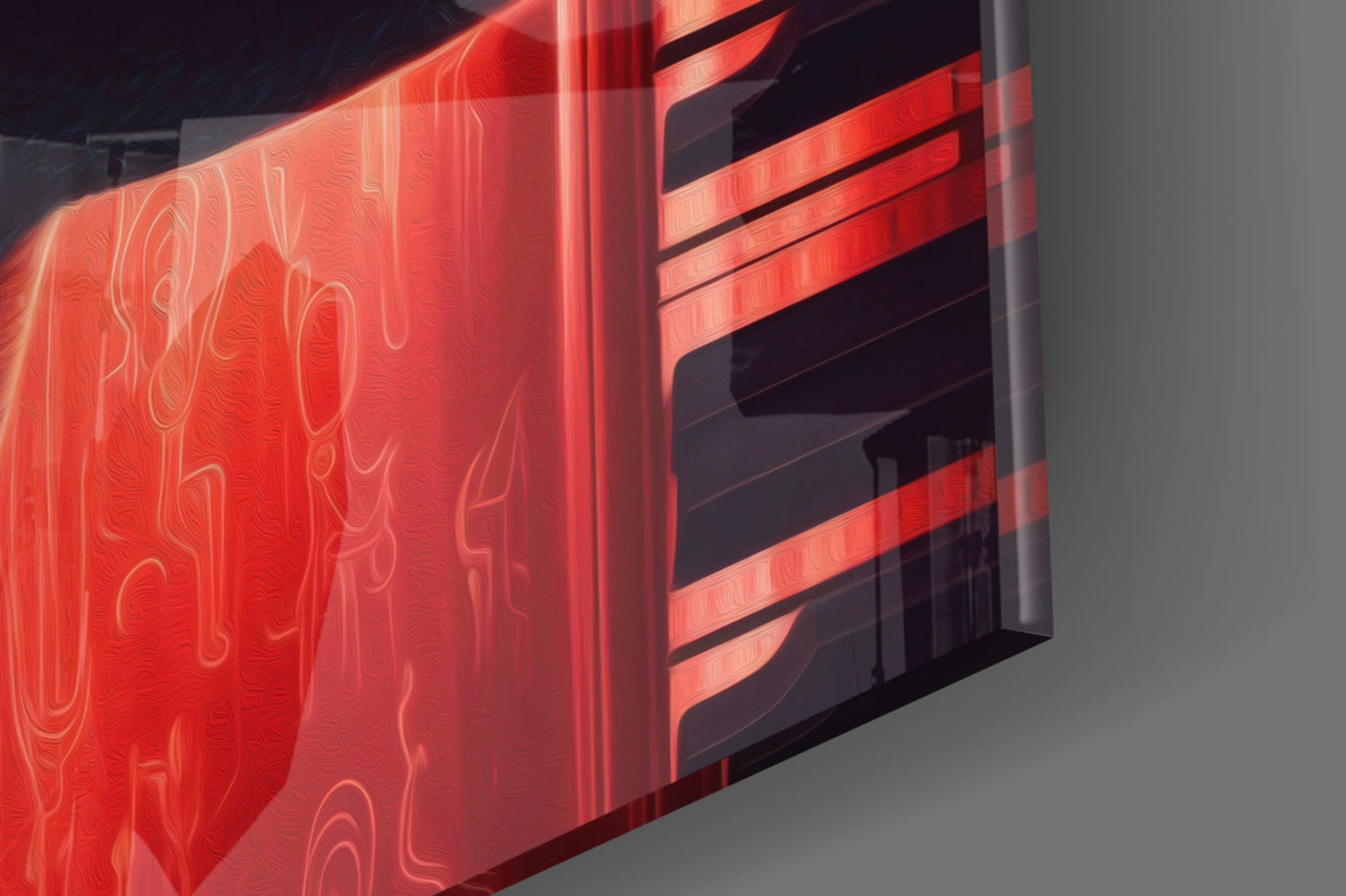 Red neon glass wall art panel with decorative swirl patterns, photographed at an angled perspective against gray background.