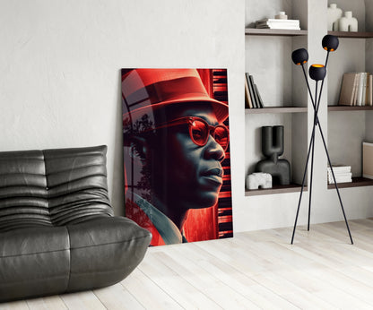 Modern living room interior featuring a red-glowing neon portrait glass art panel leaning against wall beside gray leather sofa.