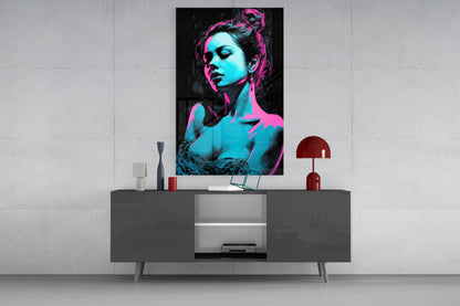 Neon pink and cyan portrait of a woman displayed above a gray media console in a modern interior setting.