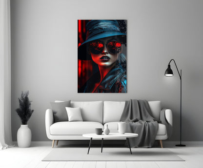 Modern living room interior featuring a portrait glass wall art depicting a woman in sunglasses and hat with red and blue lighting effects.