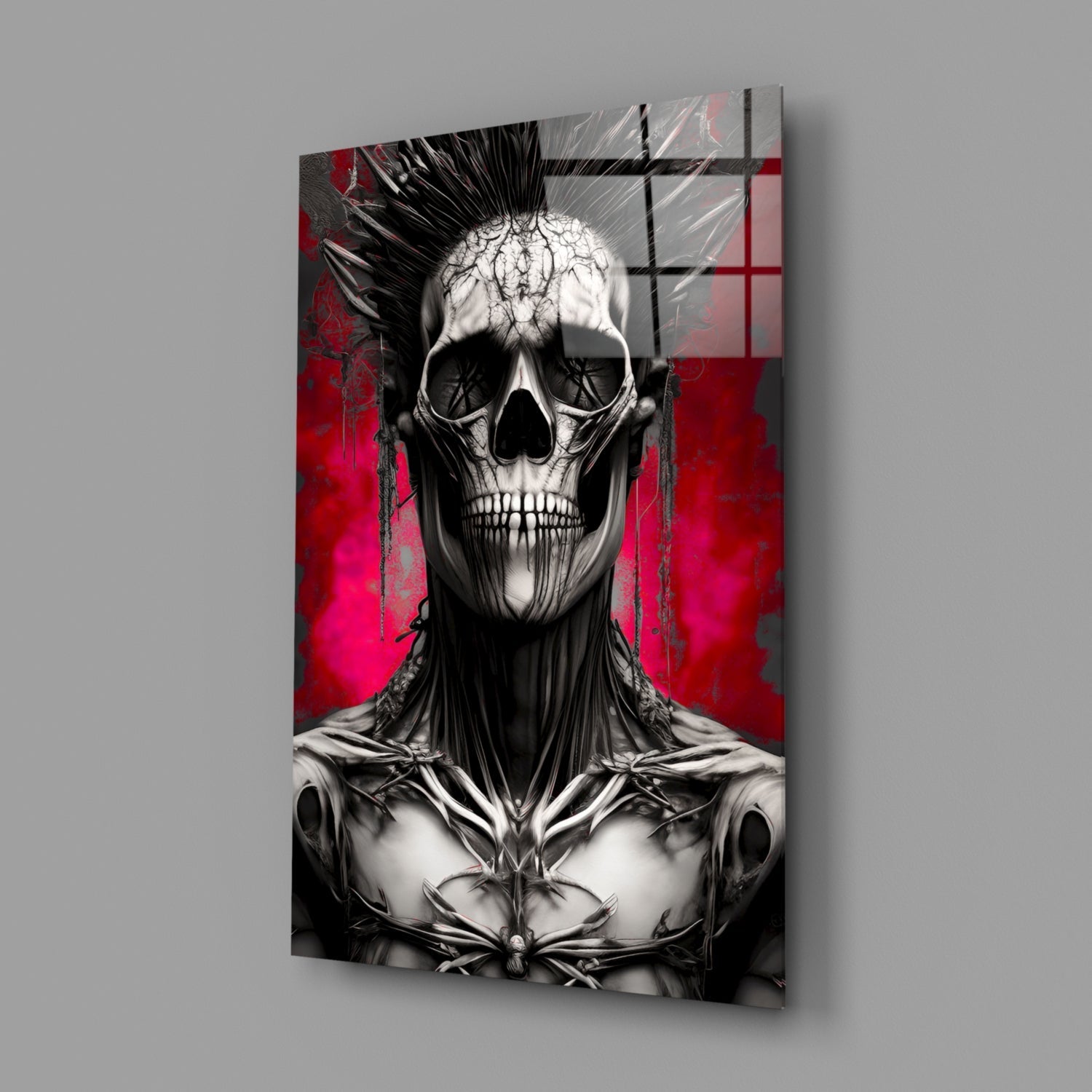 Anatomical skull with black muscle details on red and grey abstract background, displayed as angled glass wall panel.