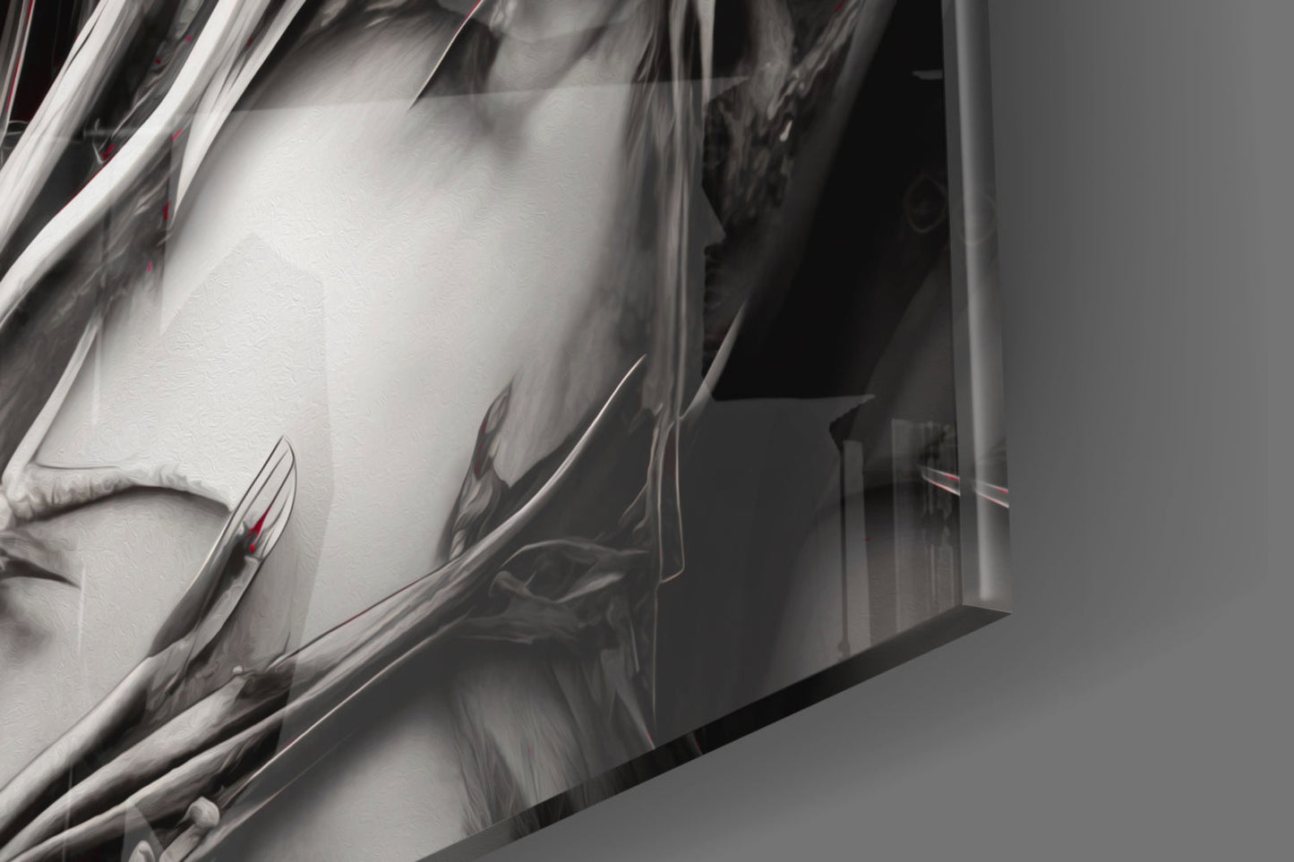Close-up detail of white and grey glass wall art with metallic chrome edge trim and red accent elements against neutral background.
