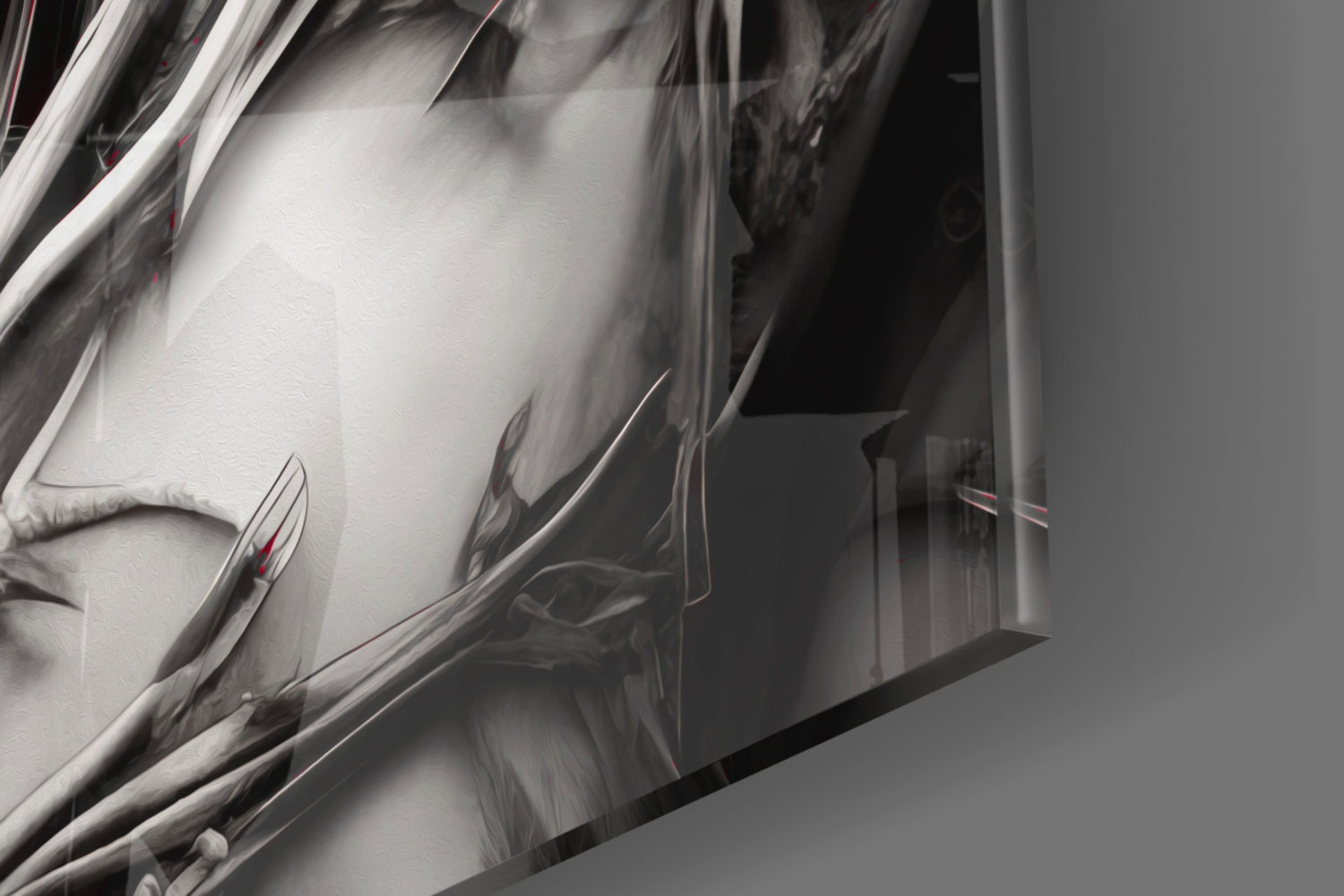 Close-up detail of white and grey glass wall art with metallic chrome edge trim and red accent elements against neutral background.
