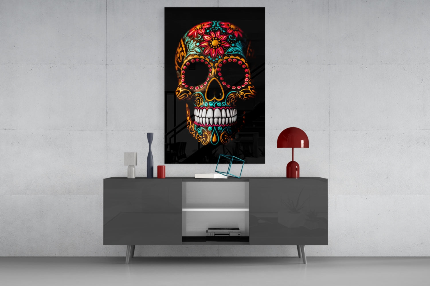 Colorful skull glass wall art with floral patterns and jeweled details displayed above a gray media console in a modern interior setting.