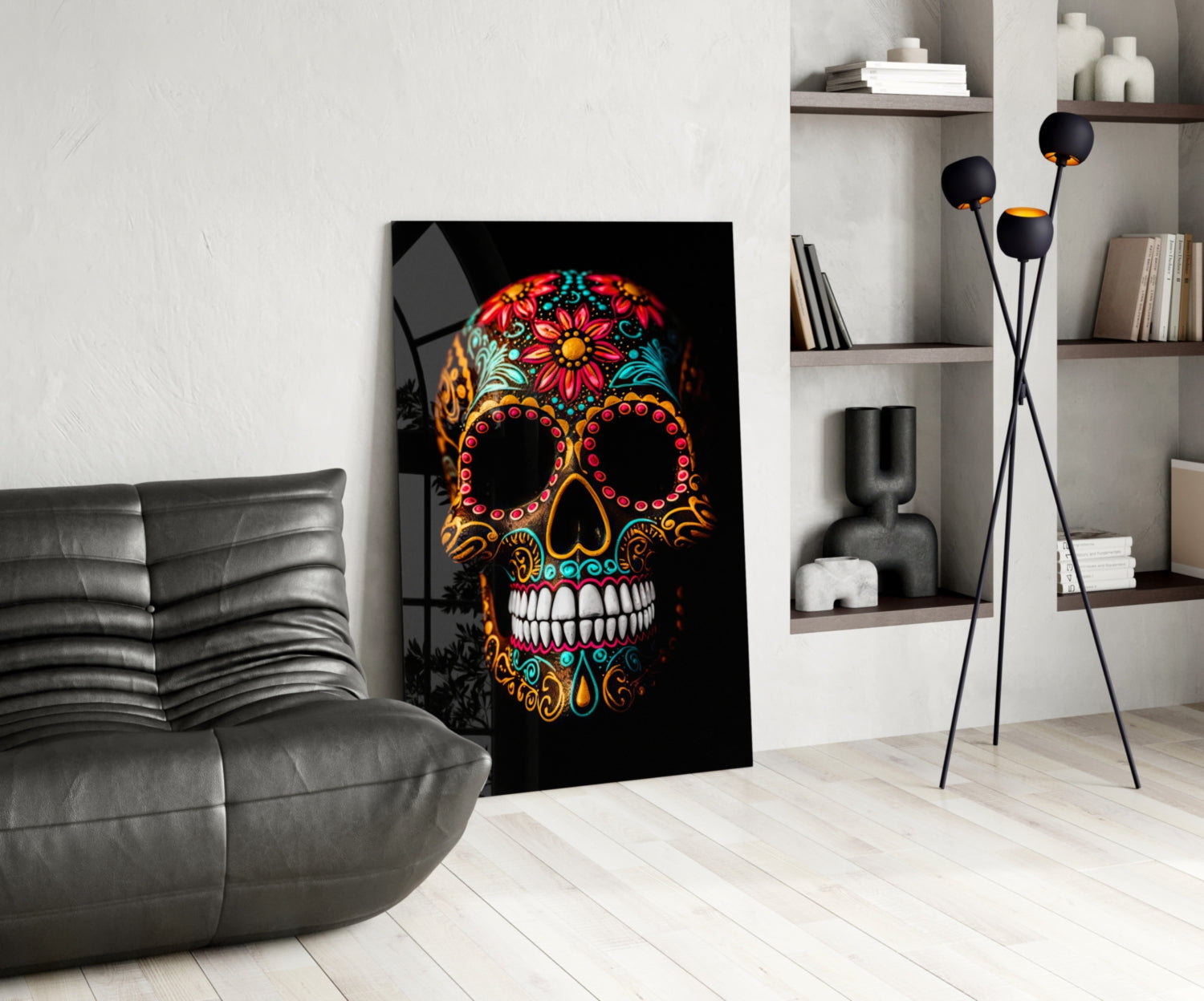 Vibrant skull glass wall art with colorful floral patterns displayed in modern living room setting beside gray leather chair.