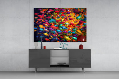 Vibrant multicolored fish glass wall art displayed above a dark gray media console in a modern living room setting.