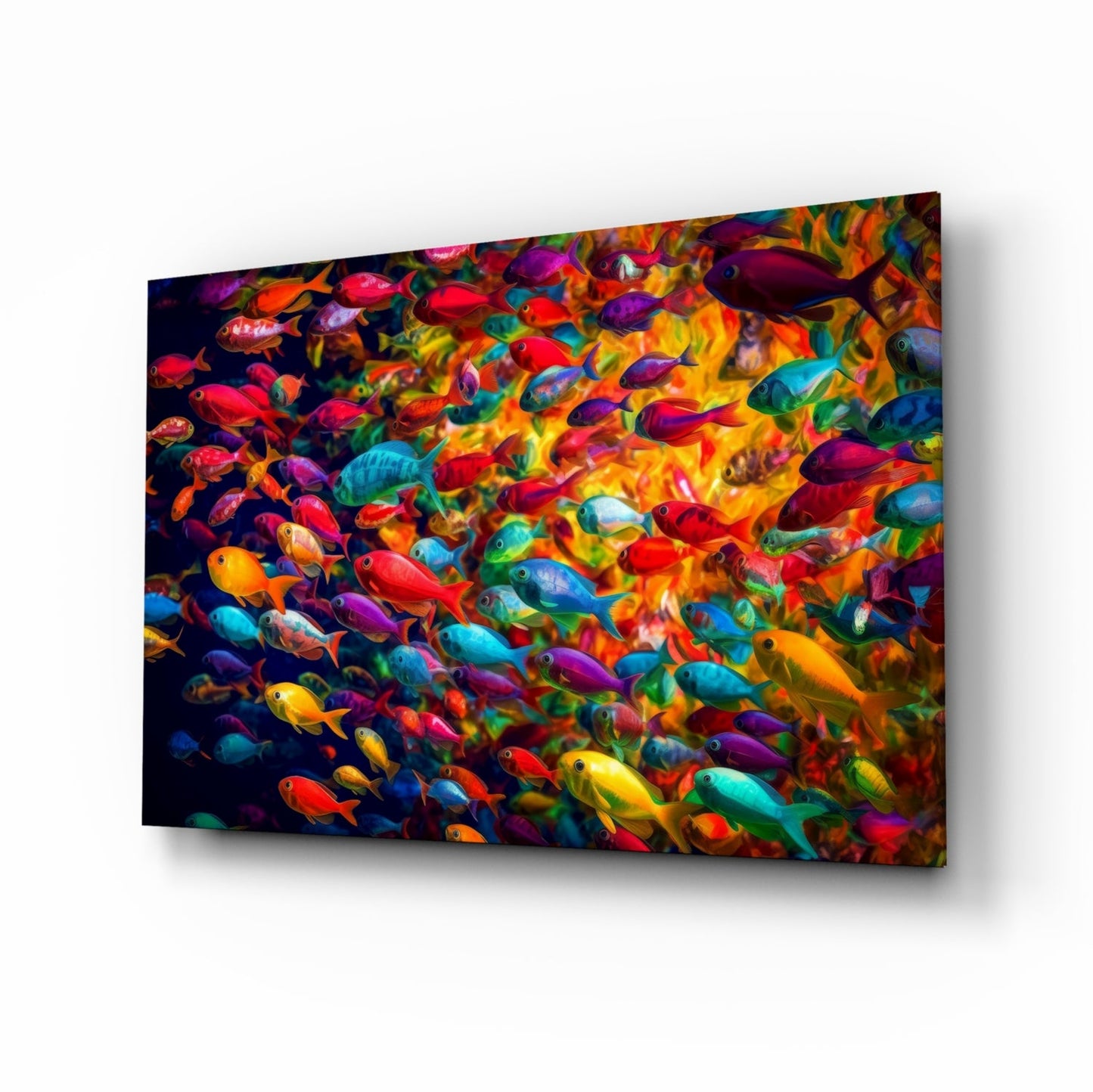 Angled perspective of glass wall art displaying a dense school of colorful tropical fish in red, blue, yellow, purple, and green hues against dark background.