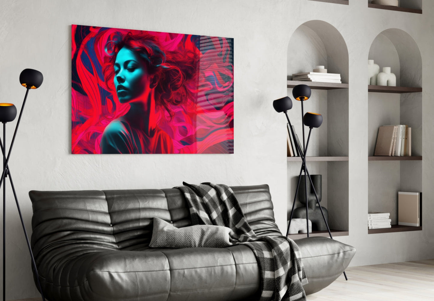 Red Feelings glass wall art featuring a woman's face in red and cyan neon colors displayed above a black leather sofa in a modern living room.
