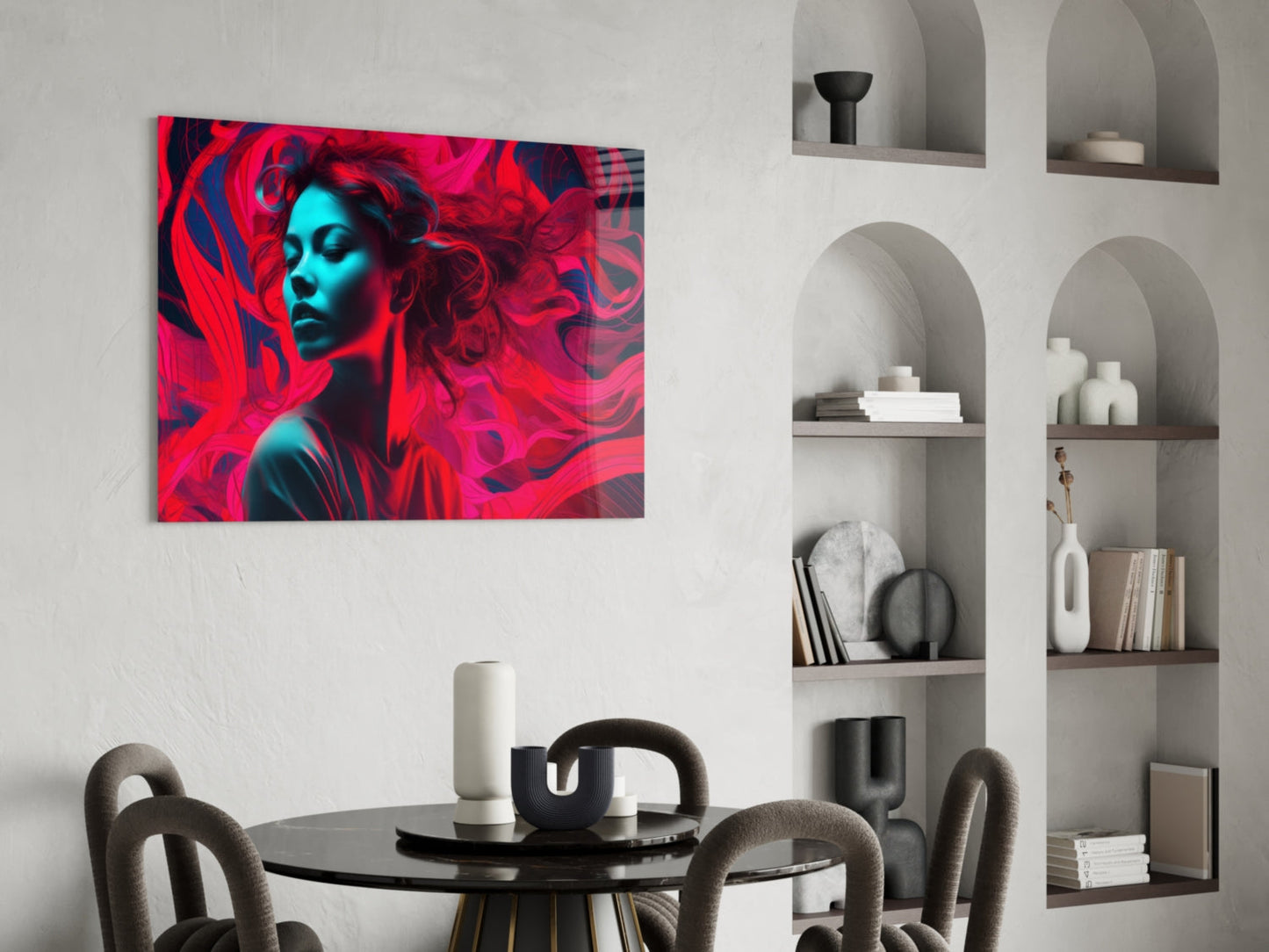 Vibrant red and cyan glass art featuring a stylized female portrait displayed above a round dining table in a modern interior.