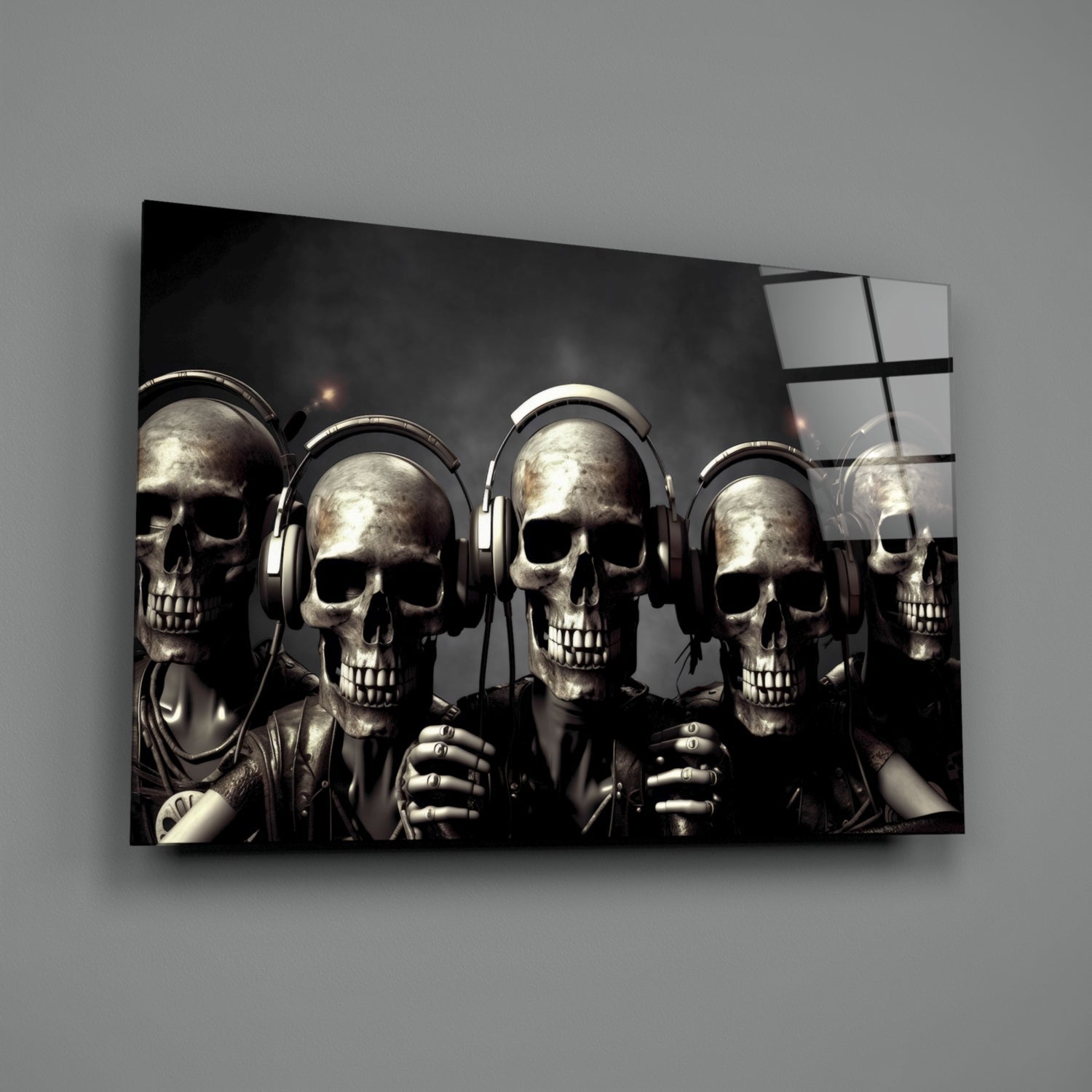 Angled wall view of glass art displaying five metallic skulls wearing headphones against a dark background with a window reflection.