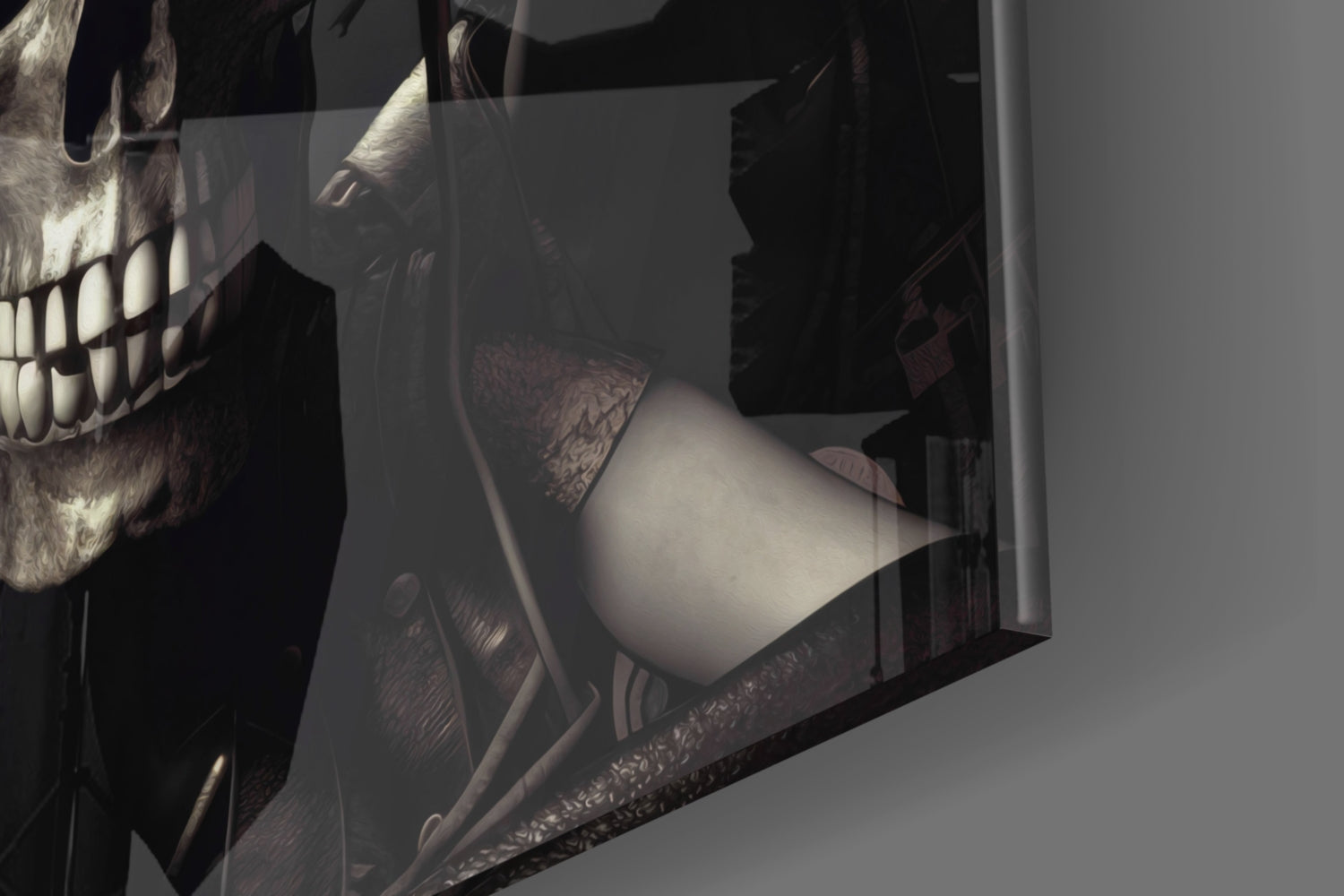 Close-up angled view of skull glass wall art showing detailed skull profile with bared teeth and decorative patterns on dark background.