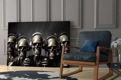 Metallic skulls wearing headphones displayed on black glass panel in modern living room with wooden chair and gray walls.