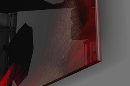 Close-up side view of glass wall art with red and brown tones showing textured surface detail and edge profile.