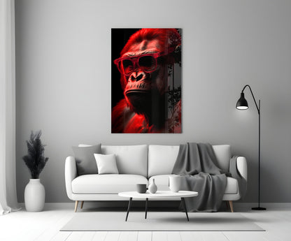 Red-lit gorilla wearing sunglasses displayed on wall above white sofa in minimalist living room setting.