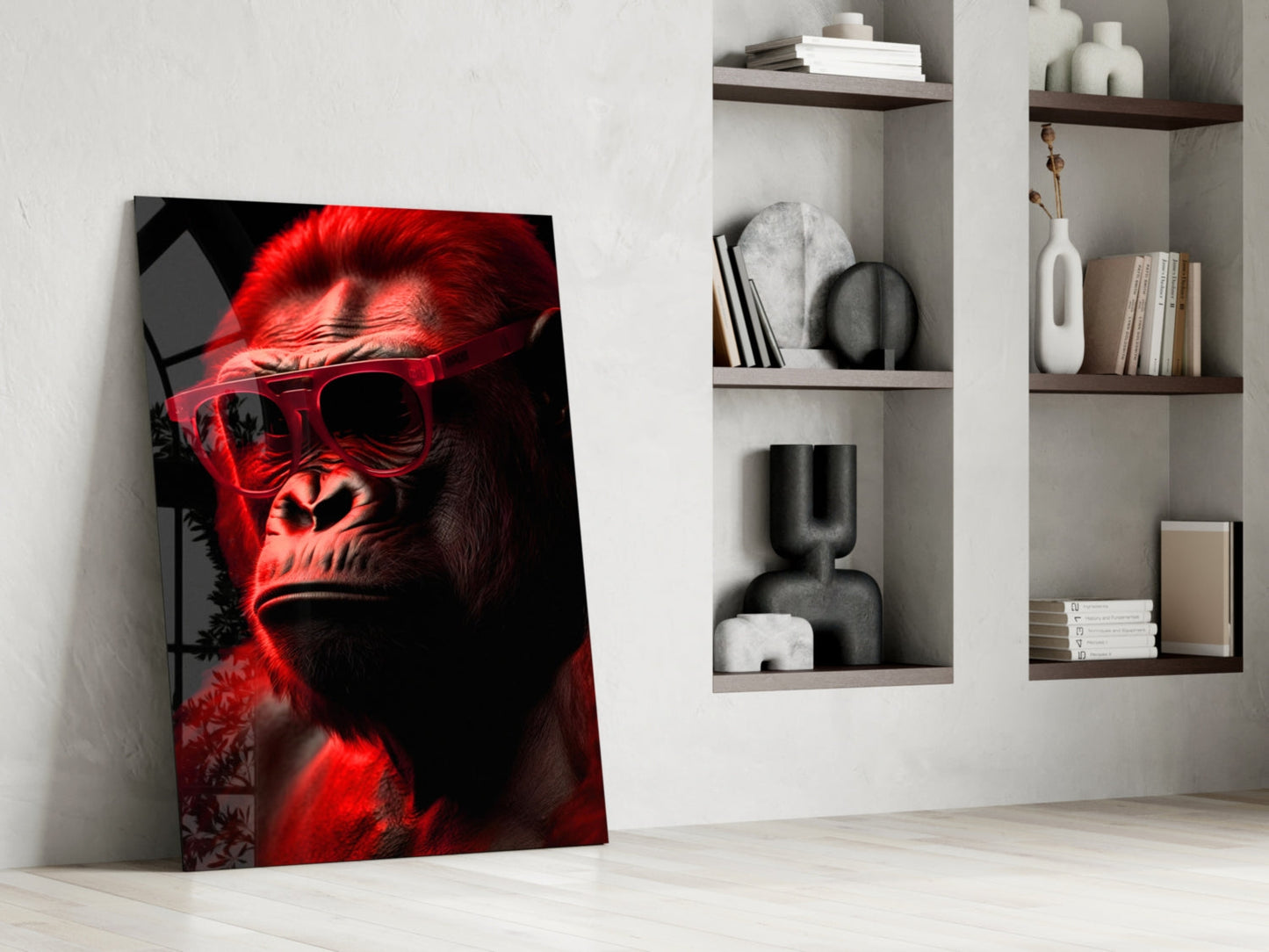 Red neon-lit primate wearing sunglasses leans against white wall beside floating shelves with decorative objects.