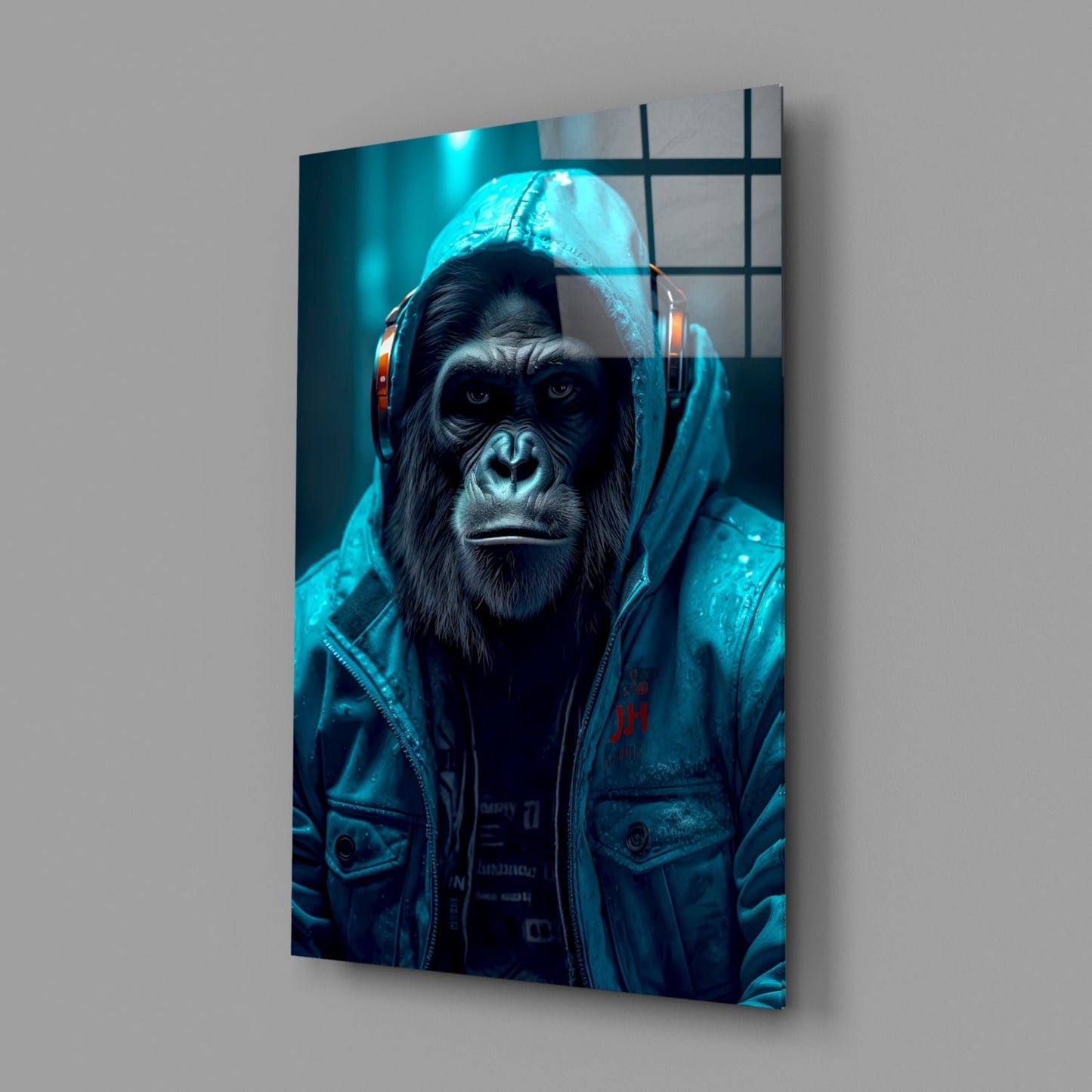 Angled view of glass wall art depicting a chimpanzee wearing headphones and a blue jacket against a teal-lit background.
