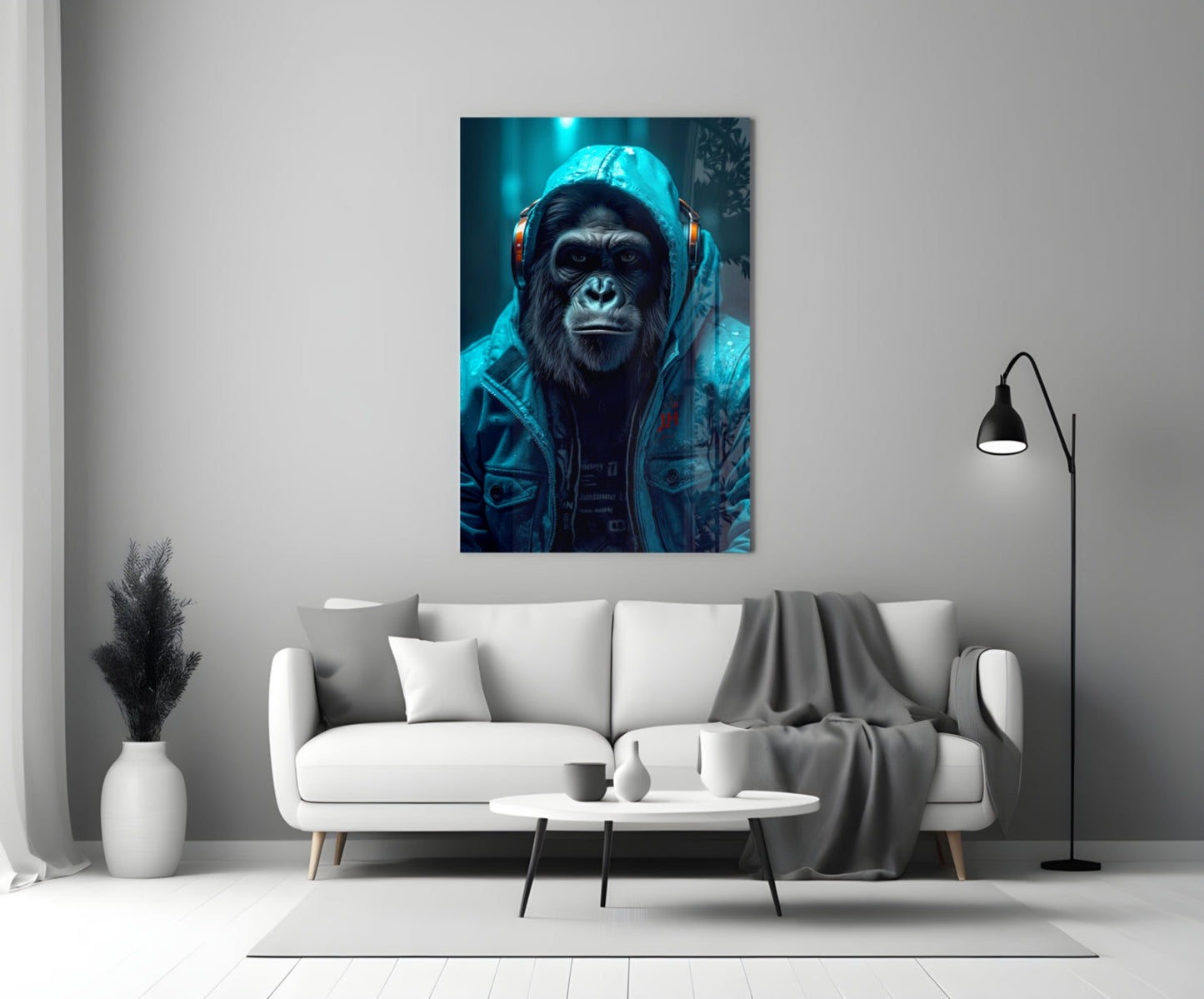 Glass wall art depicting a chimpanzee wearing headphones and a blue jacket against a dark teal background, displayed above a white sofa in a modern living room.