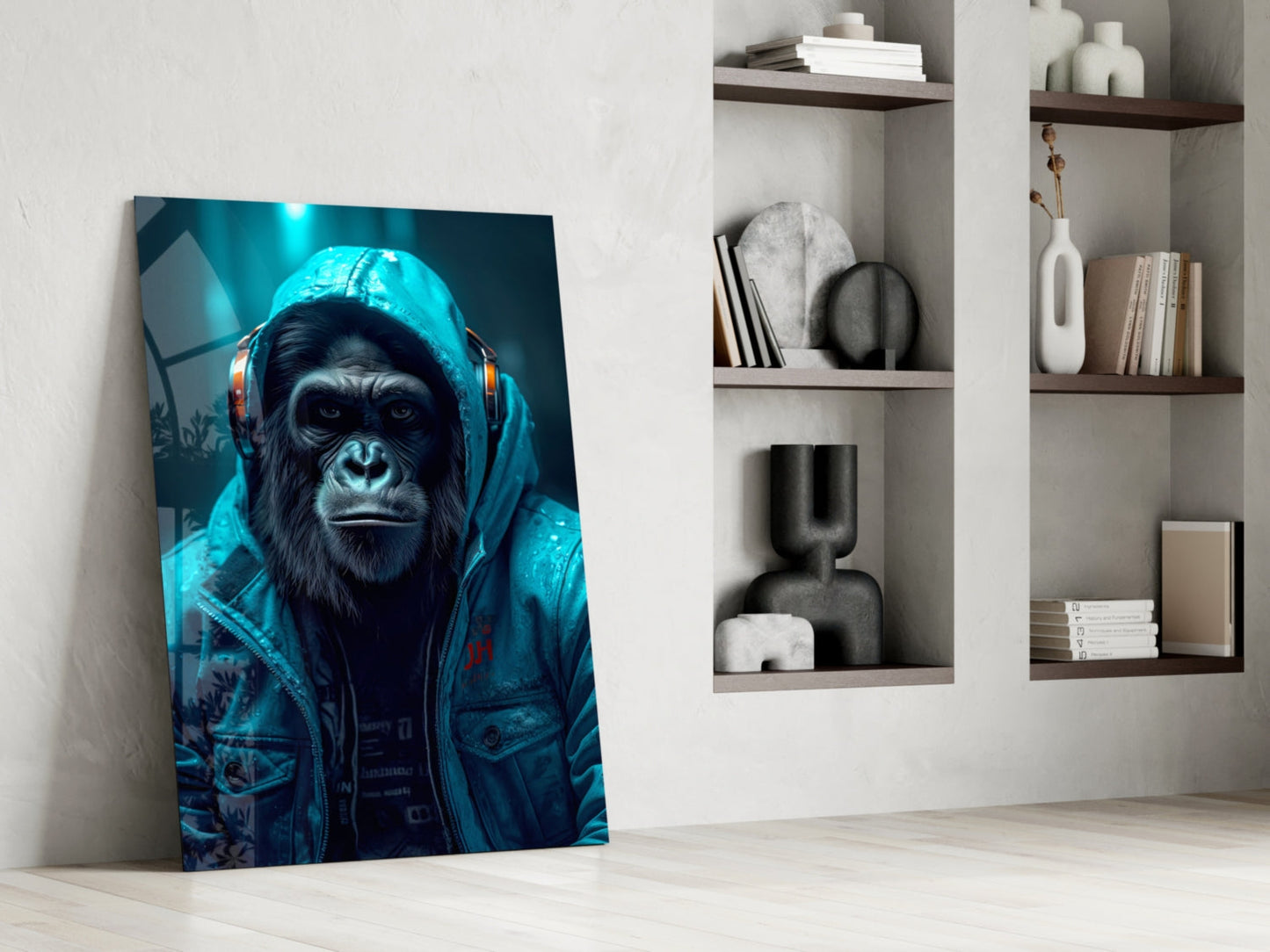 Glass wall art leaning against white wall displays a chimpanzee wearing blue headphones and jacket against teal background.