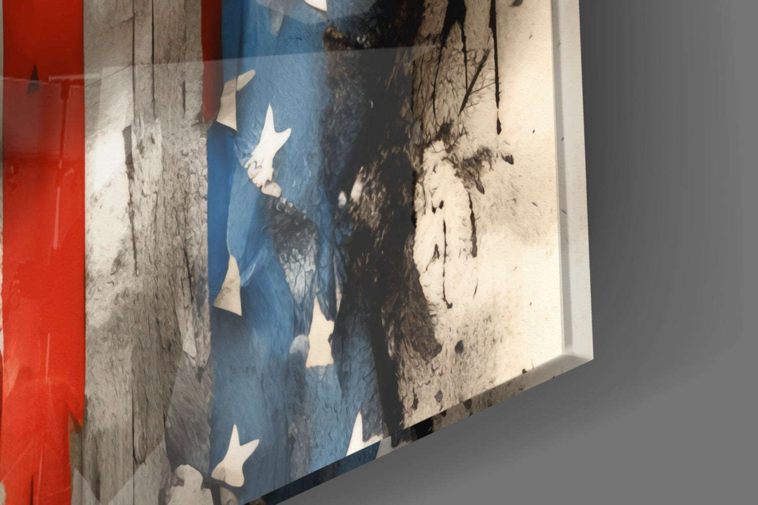 Angled view of glass wall art featuring American flag design with white stars on blue section, red panel, and weathered texture overlay, mounted on gray wall.