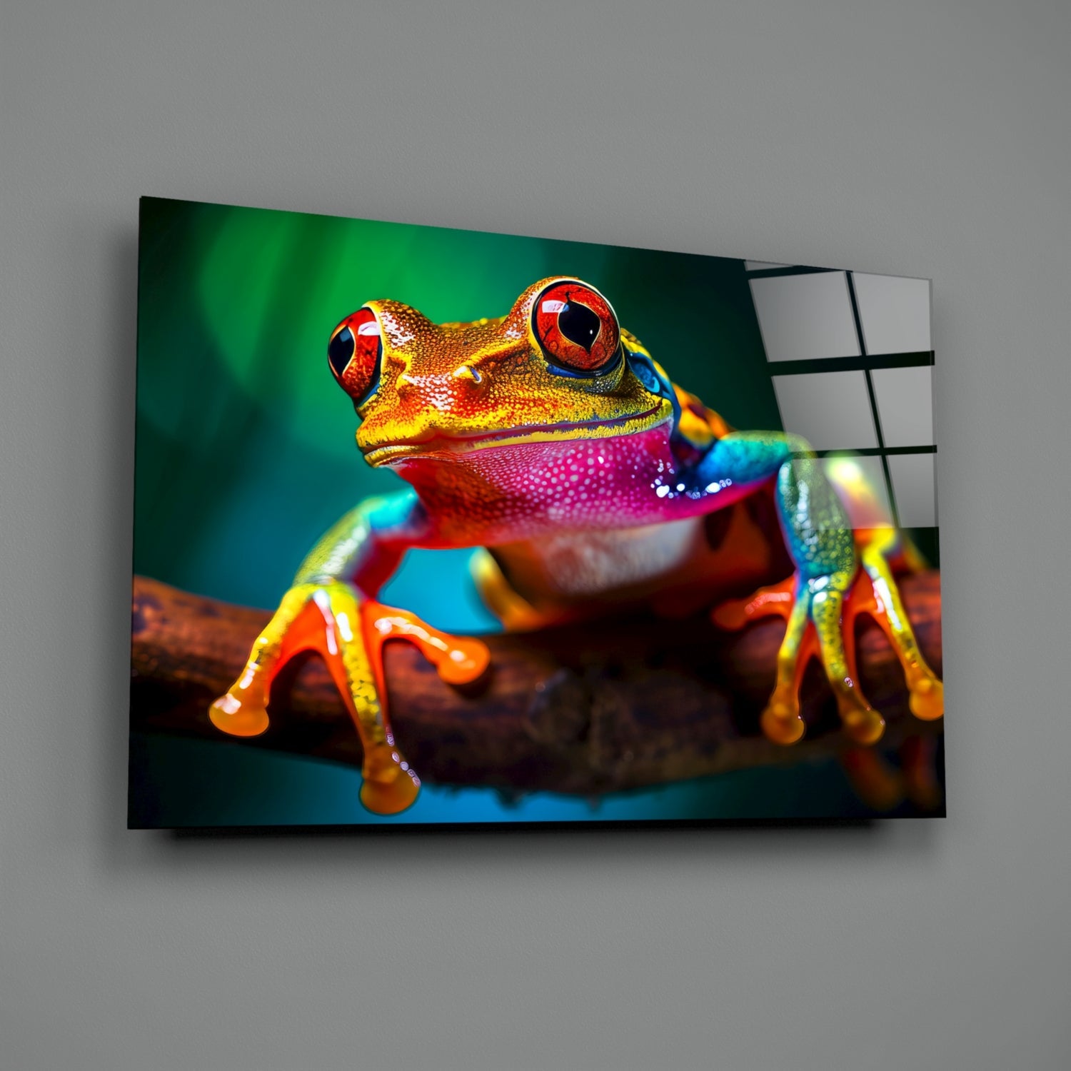 Colorful glass wall art displaying a vibrant red-eyed tree frog on a branch against a green-blue gradient background.