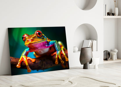 Vibrant glass wall art featuring a multicolored tree frog with red eyes leaning against a white interior wall.